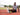 Man using a foam roller on a track field